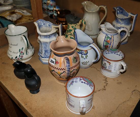 Twelve 19th century pottery jugs and two similar mugs